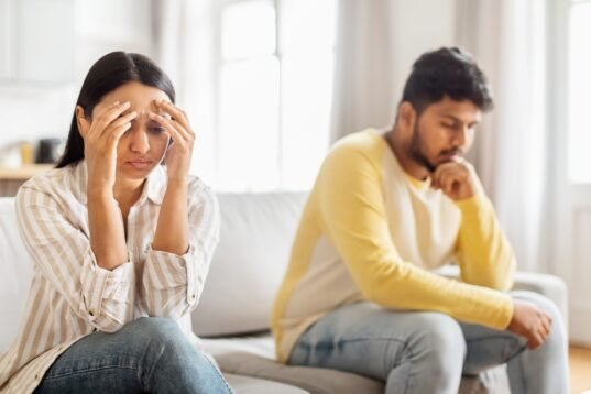 An,Upset,Indian,Woman,Sits,With,Her,Head,In,Her